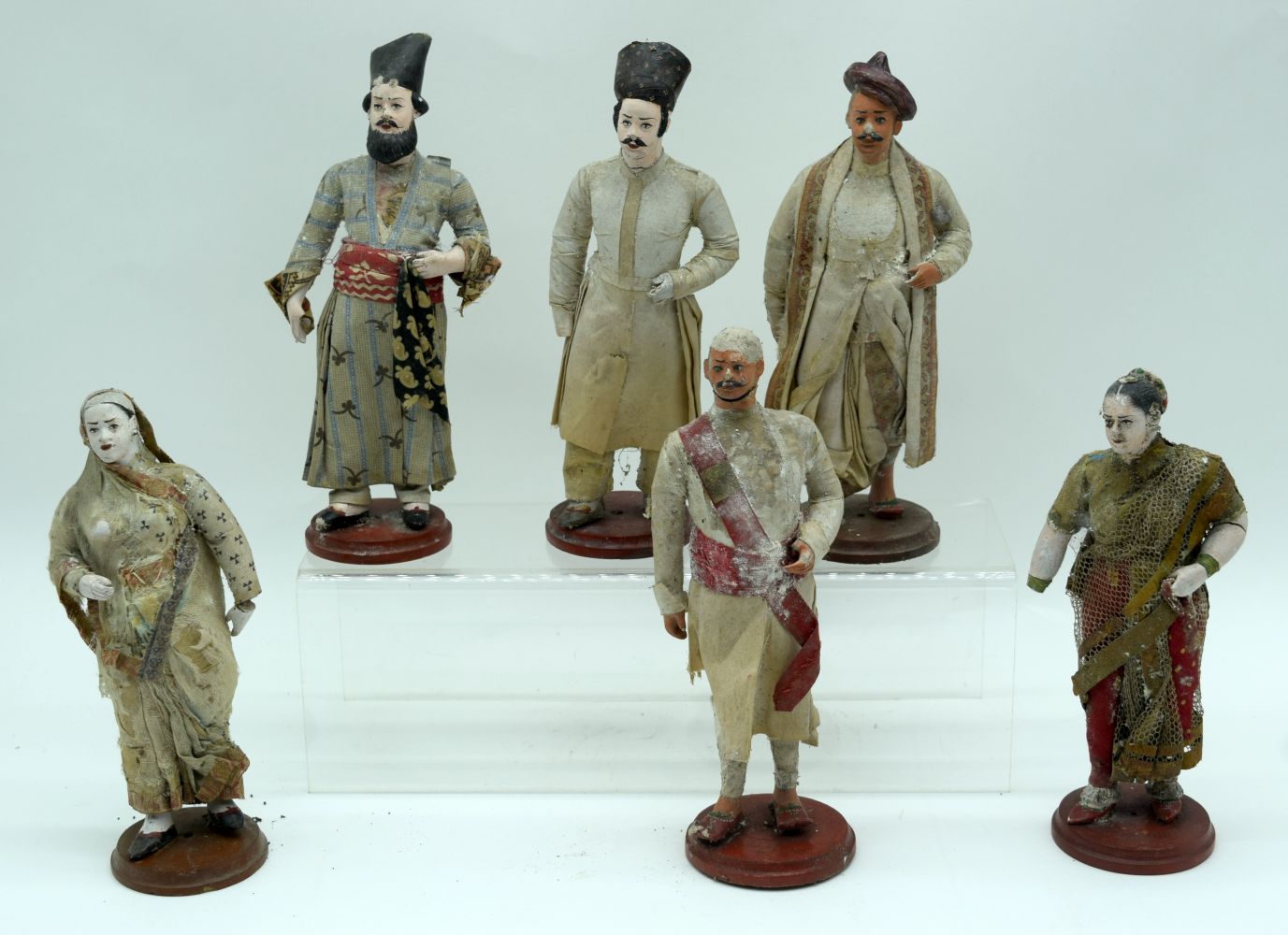 A collection of Indian Terracotta and plaster company figures. 22cm (6).