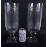 A LARGE PAIR OF CUT GLASS STORM CELERY VASES. 34 cm high.