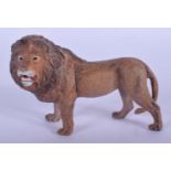 A CONTEMPORARY COLD PAINTED BRONZE LION. 9 cm x 6 cm.