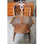 A large oak Winsor chair 111 x 63 cm .