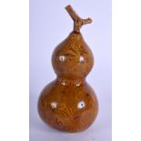A 19TH CENTURY CHINESE TREACLE GLAZED POTTERY DOUBLE GOURD Qing. 11 cm high.