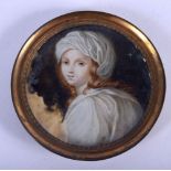 AN ANTIQUE PAINTED BONE PORTRAIT MINIATURE painted with a pretty female. 6.5 cm diameter.