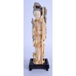 A LATE 19TH CENTURY CHINESE CARVED IVORY FIGURE OF A STANDING FEMALE Qing, modelled holding a bamboo