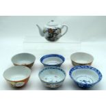 A collection of Chinese ceramic bowls and a tea pot 11 x 17cm (7).