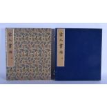 A CHINESE SILK BOUND BOOK ON PAINTINGS. 40 cm x 36 cm.