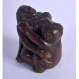 A JAPANESE CARVED BOXWOOD OKIMONO modelled as a monkey. 5 cm x 3 cm.