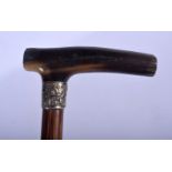 A RARE 19TH CENTURY CONTINENTAL CARVED CHILD RHINOCEROS HORN WALKING CANE with bamboo shaft. 60 cm l