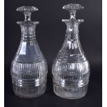 A PAIR OF GEORGE III CUT GLASS DECANTERS. 22 cm high.