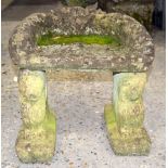 Two stone gargoyle statues with a concrete seat . 47 x 49 x 38.