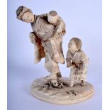 A 19TH CENTURY JAPANESE MEIJI PERIOD CARVED IVORY OKIMONO modelled as a mother and child. 15 cm x 9