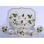 AN AESTHETIC MOVEMENT PORCELAIN TEASET decorated with strawberry plants. Tray 40 cm x 28 cm. (8)