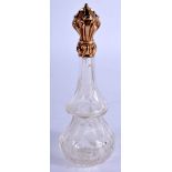 AN ANTIQUE 18CT GOLD AND CRYSTAL GLASS SCENT BOTTLE. 10 cm high.