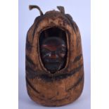 AN EARLY 20TH CENTURY JAPANESE MEIJI PERIOD BOXWOOD OKIMONO with jovial mask heads. 11 cm x 5 cm.