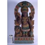 A LARGE INDIAN CARVED POLYCHROMED WOOD FIGURE OF FOUR ARMED DURGA modelled with a lion behind her. 5