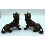 A pair of Tibetan bronze Kylin beasts 20 x 25cm. (2)