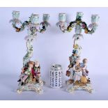A PAIR OF 19TH CENTURY MEISSEN PORCELAIN CANDELABRA with figural supports. 38 cm x 15 cm.