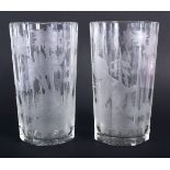 A PAIR OF BOHEMIAN ENGRAVED GLASSES decorated with birds and landscapes. 15 cm high.