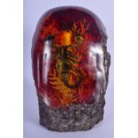 A CONTEMPORARY CONTINENTAL CARVED AMBER BOULDER. 24 cm x 13 cm.