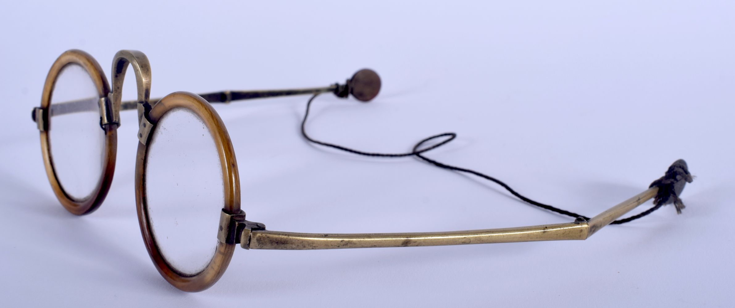 A RARE PAIR OF EARLY 20TH CENTURY CHINESE CARVED RHINOCEROS HORN SPECTACLES with folding arms. 14 cm - Image 3 of 4
