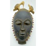 TRIBAL AFRICAN ART BAULE MASK from the Ivory Coast, between region Boauflé and Bosi, a hollowed oval