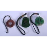 THREE JADE PLAQUES 20th Century. Largest 4.5 cm wide. (3)