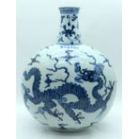 A large Chinese blue and white Moon flask decorated with a dragon 45 x 36cm.