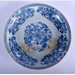 A 17TH CENTURY CHINESE BLUE AND WHITE PORCELAIN DISH Late Transitional Period, painted with floral s