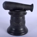 AN ANTIQUE CAST IRON PESTLE AND MORTAR. 12 cm x 10 cm. (2)