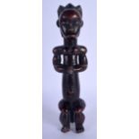 AN EARLY 20TH CENTURY AFRICAN TRIBAL MUSCULAR FIGURE of good rich colour. 24 cm high.