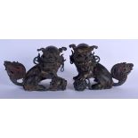 A PAIR OF CHINESE BRONZE FIGURES OF BUDDHISTIC LIONS 20th Century, one modelled upon a young, one mo