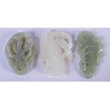 THREE CHINESE CARVED JADE PLAQUES 20th Century. Largest 4.5 cm x 3 cm. (3)