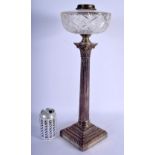 A LARGE ANTIQUE SILVER COLUMN OIL LAMP with cut glass lamp. 49 cm high.