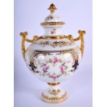 Late 19th/early 20th c. Coalport two handled vase and cover painted with wreaths of roses below gild