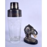 A RETRO COCKTAIL SHAKER together with an art deco elephant table lighter. Largest 21 cm high. (2)