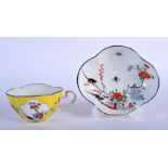 A 19TH CENTURY MEISSEN PORCELAIN LOBED CUP AND SAUCER painted with birds and kakiemon type floral pa