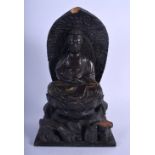 A 19TH CENTURY JAPANESE MEIJI PERIOD CARVED WOOD FIGURE OF A BUDDHA modelled with hands clasped. 30