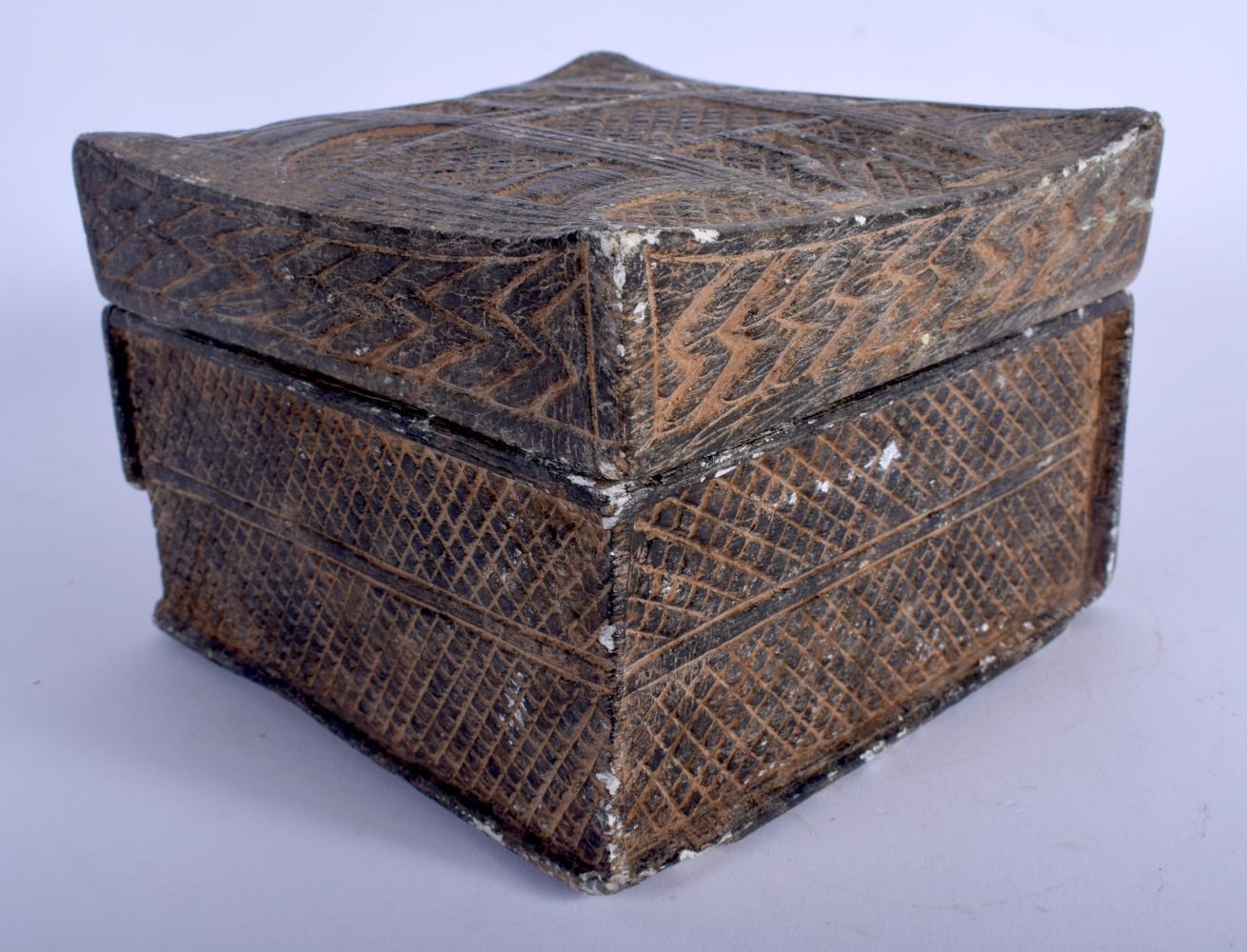 A MIDDLE EASTERN CARVED STONE BOX AND COVER possibly for medicine. 15 cm x 11 cm.