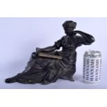A 19TH CENTURY FRENCH BRONZE FIGURE OF A FEMALE modelled resting upon her elbow. 30 cm x 23 cm.