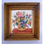 A VICTORIAN PRINTED AND PAINTED PORCELAIN TILE decorated with urns of foliage. Tile 21 cm x 18 cm.