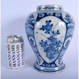 AN 18TH CENTURY DUTCH DELFT BLUE AND WHITE BALUSTER VASE painted with floral sprays. 23 cm x 12 cm.