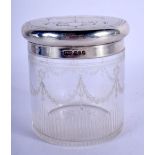 AN ANTIQUE SILVER TOPPED DRESSING TABLE JAR. London 1916. Silver 93 grams. 10 cm wide.
