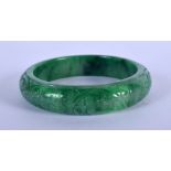 A CHINESE SPINACH JADEITE BANGLE 20th Century. 7.5 cm wide.