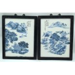 A pair of framed Chinese Blue and white ceramic plaques depicting mountainous scenes.32 x24cm (2).