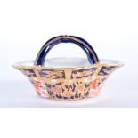 Royal Crown Derby unusual miniature fish basket painted with pattern 6299, date code 1919./ 7cm lon