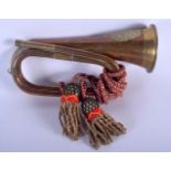 AN ANTIQUE MILITARY ARGYLL & SUTHERLAND REGIMENT COPPER BUGLE. 30 cm wide.