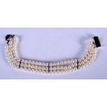 A SILVER AND PEARL BRACELET. 15 cm long.