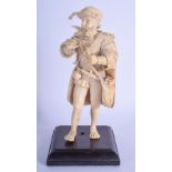 A MID 19TH CENTURY EUROPEAN CARVED DIEPPE IVORY FIGURE OF A CAVALIER modelled roaming holding bottle