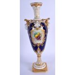 Royal Worcester two handled vase with blue ground and child face masks, painted with fruit in a gilt