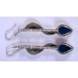 A PAIR OF SILVER EARRINGS. 12 grams. 5 cm long.