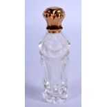 AN ANTIQUE GOLD TOPPED SCENT BOTTLE. 11 cm high.